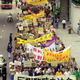 Led by legislators, more than 1,000 people join a rally Sunday, April 14, 1996, to protest China's plans to replace the current legislature with a Beijing-appointed legislature after Hong Kong returns to Chinese sovereignty in 1997. Sign at front reads "Protest the setting up of the provisional legislature."
